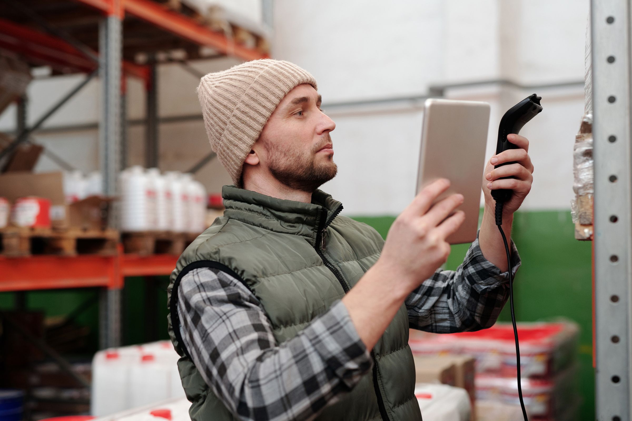 Worker scanning inventory with a handheld reader