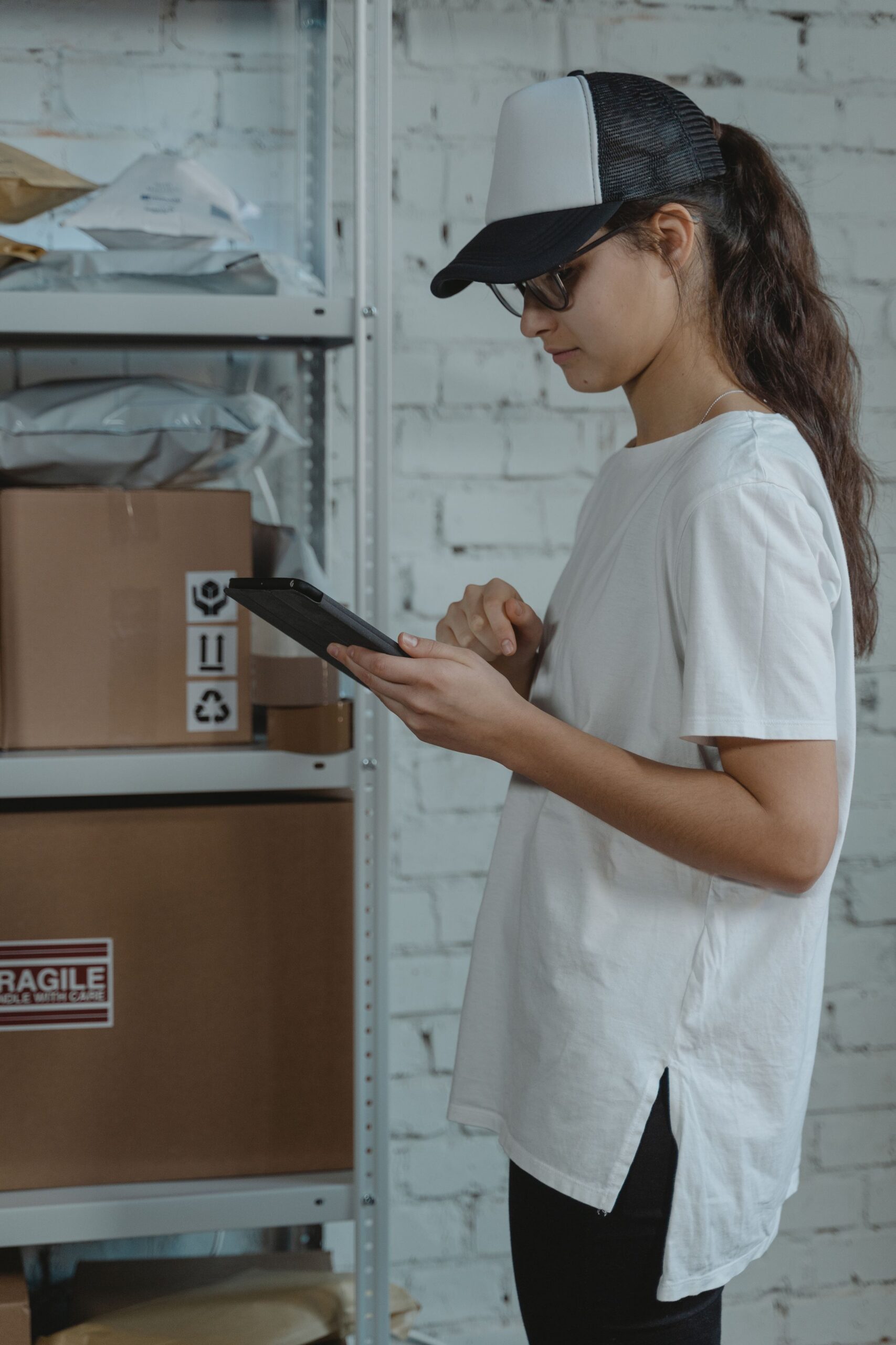 Warehouse employee checking stock on a tablet