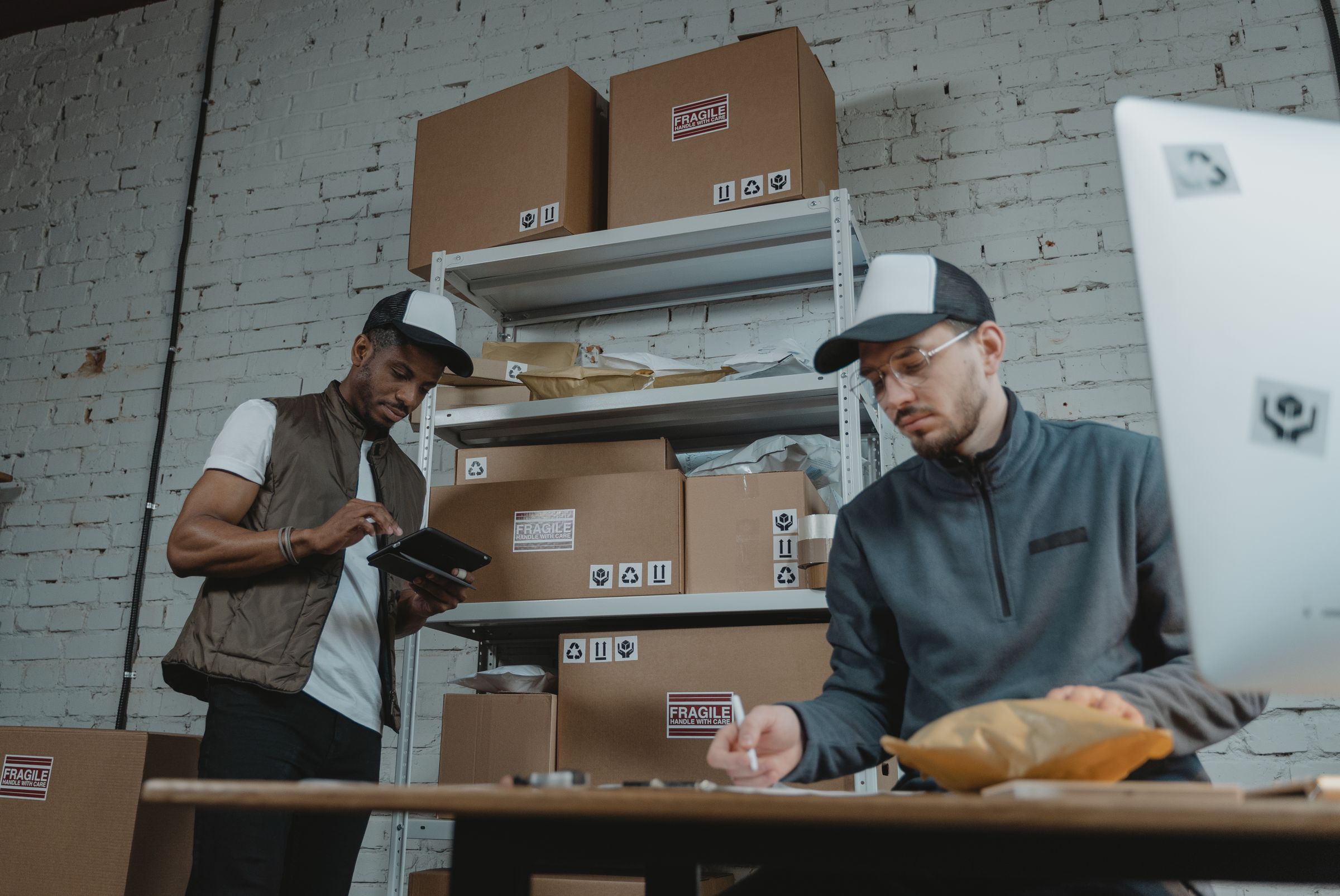 Warehouse staff checking and preparing parcels